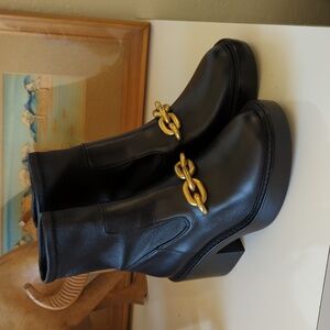 Coach Black Heeled Boots with Gold Chain Accent